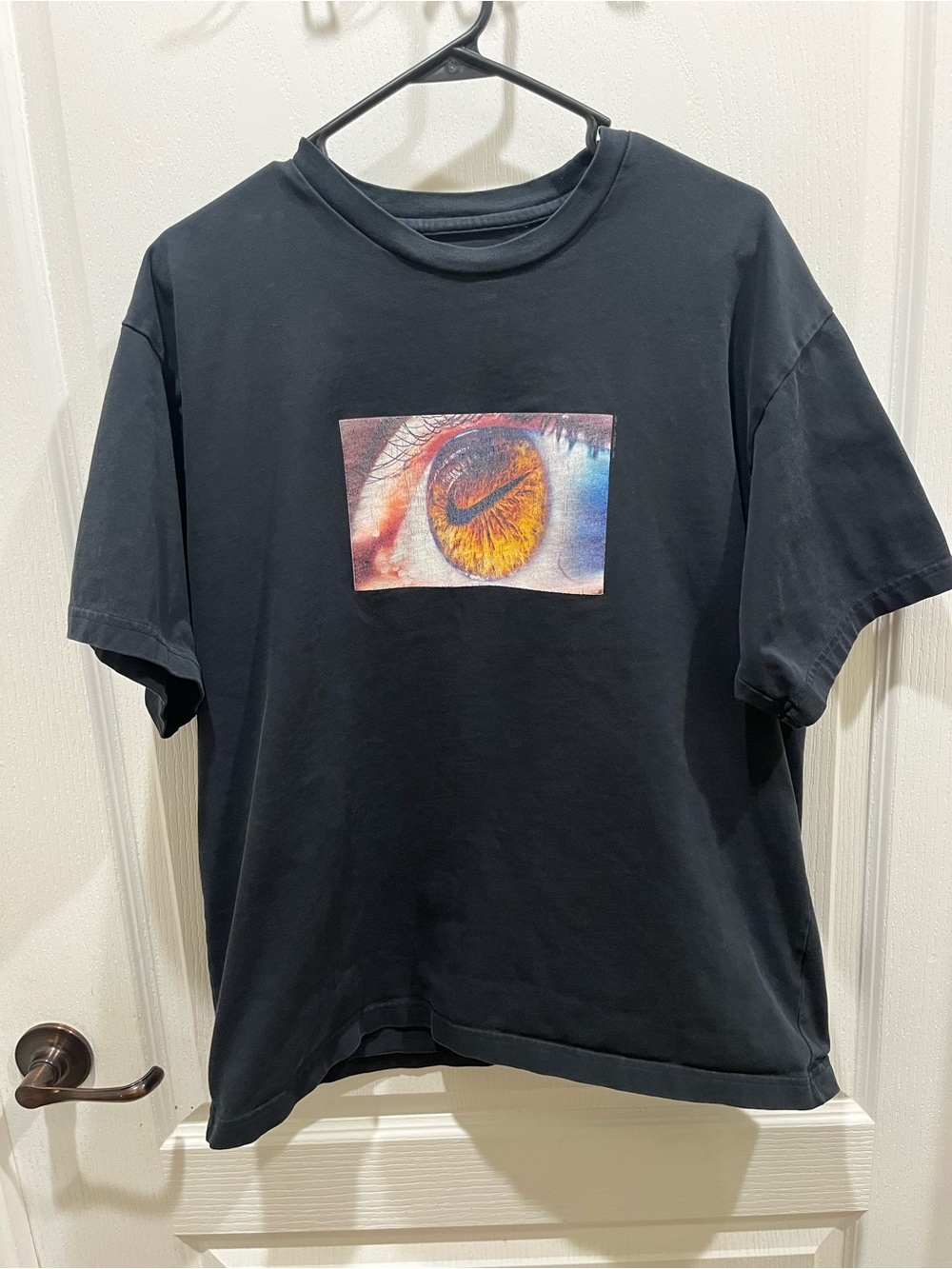 Nike Black Short Sleeve Tee with Orange Eye Graphic